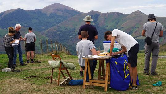 team working in the mountain with a table