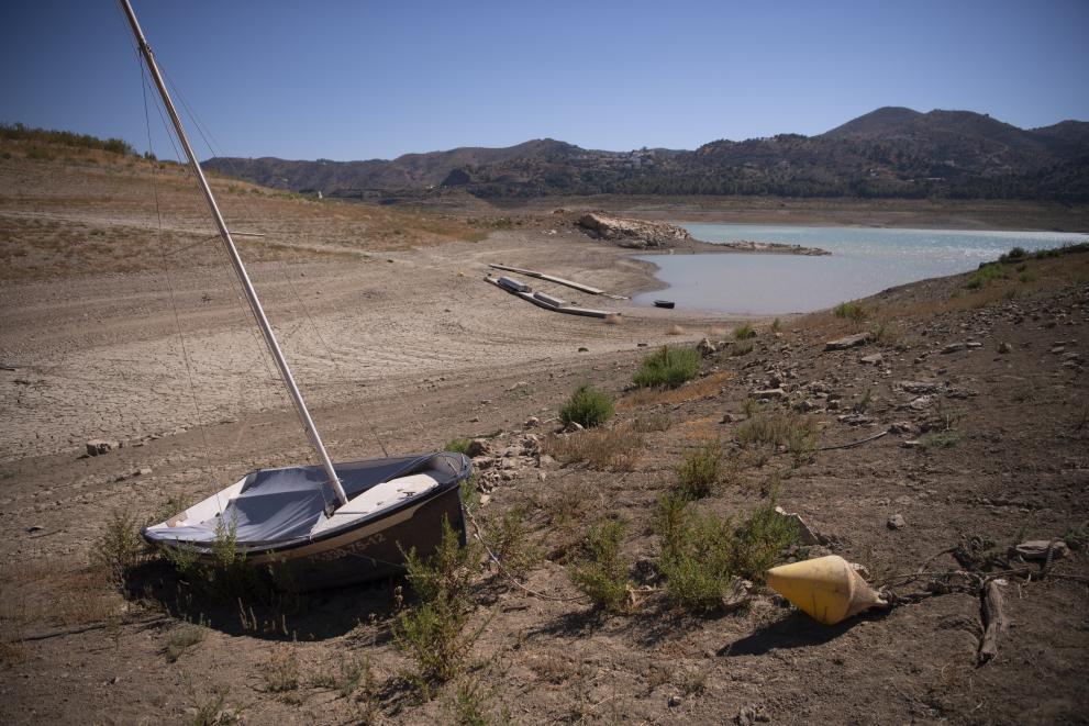 Small vessel next to a drying lake