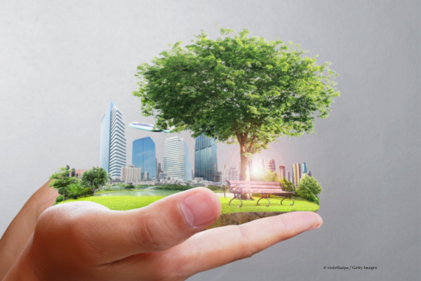 Green city in hands image