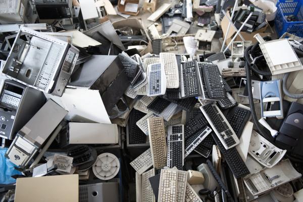Discarded PC keyboards and towers.