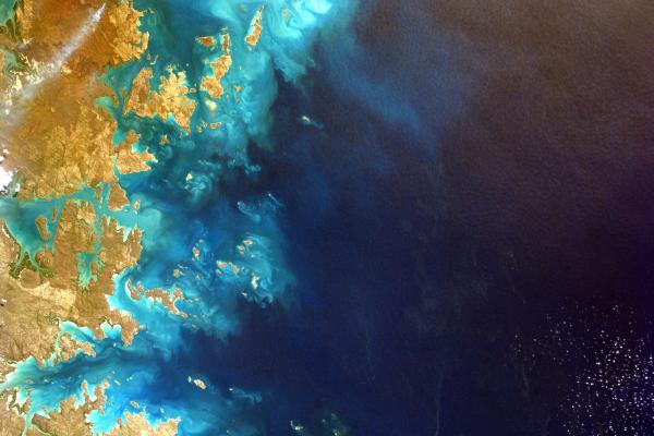Image of ocean and part of coast captured from satellite.